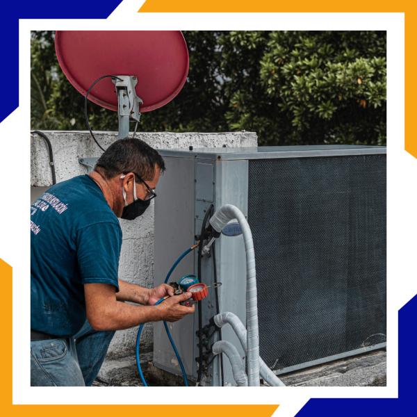 man fixing HVAC unit