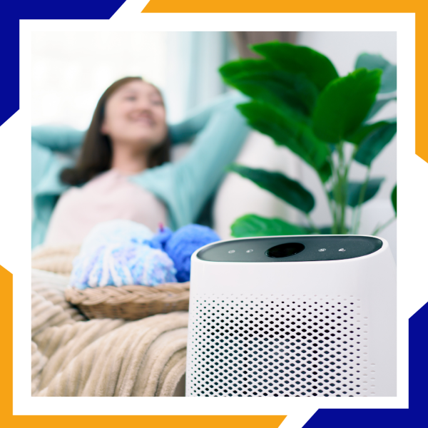 woman sitting back by a air purifier